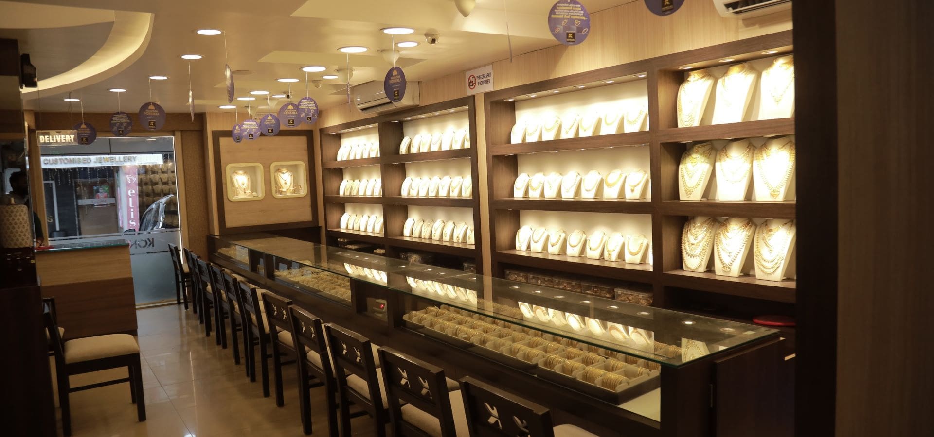 Inside the Thrimurti Jewellers showroom — gold display counters, Koyilandy